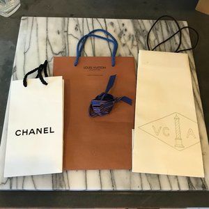 Chanel, Vuitton and Van Cleef Arpel shopping bags